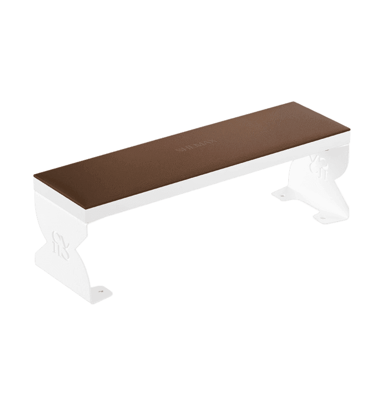 A white bench with ornate legs and a brown seat, isolated on a black background.